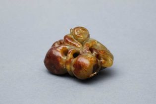 A CHINESE RUSSET JADE 'MONKEY AND PEACH' GROUP 青 玉靈猴偷桃把件