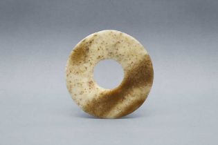 A SMALL CHINESE ARCHAIC MOTTLED JADE DISC, BI 新石器時代 齊家文化 玉璧