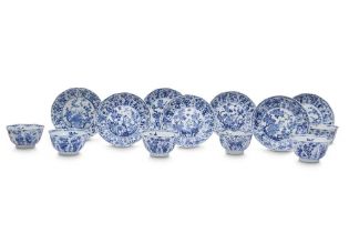 SIX CHINESE BLUE AND WHITE 'LOTUS PETALS' CUPS AND SEVEN SAUCERS 清康熙 青花繪蓮紋盃六隻及碟七隻