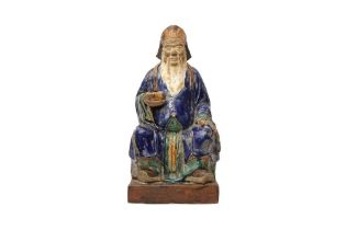 A LARGE CHINESE SHIWAN POTTERY FIGURE OF AN OFFICIAL 清 石灣窯士大夫像