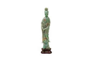 A CHINESE JADE CARVING OF GUANYIN 二十世紀 玉雕觀音立像