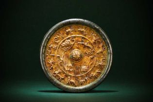 A CHINESE SILVERED PARCEL-GILT BRONZE 'ZODIAC' MIRROR 隋 局部鎏金生肖紋鍍銀銅鏡