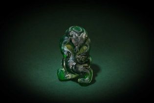 A CHINESE GREEN GLASS FIGURE OF A BEAR 漢 綠琉璃熊形擺件