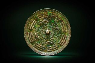 A CHINESE SILVERED BRONZE 'EIGHT TRIGRAMS' MIRROR 漢 青銅八卦紋鍍銀鏡