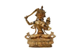 A TIBETAN GILT-BRONZE FIGURE OF MANSJUSHRI 十八至十九世紀 銅鎏金文殊菩薩坐像