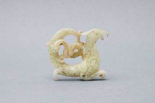 A CHINESE PALE CELADON JADE 'CHILONG AND PHOENIX' CARVING 戰國時代或後期 青白玉雕龍鳳