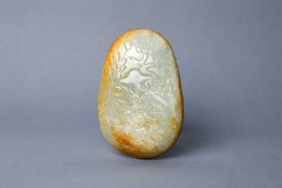 A CHINESE CELADON AND RUSSET JADE PEBBLE-SHAPED CARVING 清 青玉雕鹿紋卵石