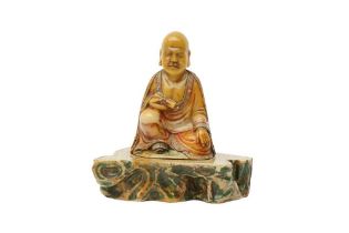 A CHINESE INLAID SOAPSTONE FIGURE OF A LUOHAN 清十八世紀 壽山石羅漢坐像