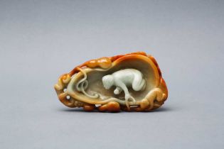 A CHINESE CELADON AND RUSSET JADE 'MONKEY' BRUSH WASHER 清 青玉糖色靈猴獻壽洗