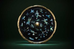 A CHINESE MOTHER OF PEARL-INLAID LACQUERED 'HUNTER' MIRROR 唐或後期 黑漆嵌螺鈿狩獵圖紋鏡