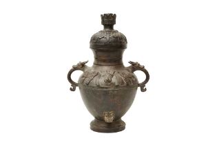 A CHINESE ARCHAISTIC BRONZE 'OX' VASE AND COVER 清十八至十九世紀 銅仿古犧首罍