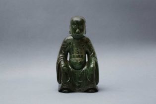 A CHINESE SPINACH-GREEN JADE FIGURE OF AN IMMORTAL 清 碧玉仙人坐像