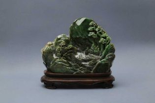 A CHINESE SPINACH-GREEN JADE 'MOUNTAIN' CARVING 清 碧玉雕松下高士圖山子