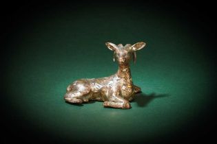 A CHINESE GOLD- AND SILVER-INLAID BRONZE 'DEER' FIGURE 戰國 銅錯金銀鹿形擺件