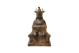 A CHINESE GILT-BRONZE FIGURE OF A SEATED LADY 清十八世紀 銅鎏金西王母像