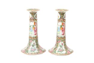 A PAIR OF CHINESE CANTON FAMILLE-ROSE CANDLESTICKS 清十九世紀 廣彩人物故事圖紋燭臺一對