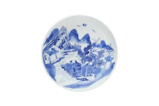 A CHINESE BLUE AND WHITE 'LANDSCAPE' DISH 清 青花山水圖紋盤