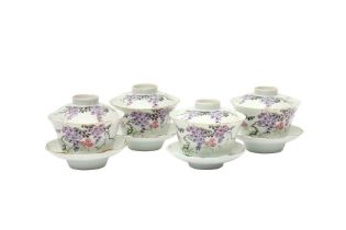 A SET OF FOUR CHINESE FAMILLE-ROSE 'WISTERIA' CUPS, COVERS AND STANDS 民國時期 粉彩過枝藤蘿蓋盌連托