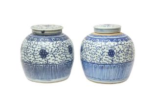 A PAIR OF CHINESE BLUE AND WHITE JARS AND COVERS 清十九世紀 青花花卉紋蓋瓶一對