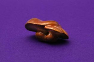 A JAPANESE WOOD MUSHROOM GROUP NETSUKE