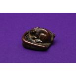 A JAPANESE WOOD 'RAT' NETSUKE