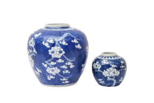 TWO CHINESE BLUE AND WHITE 'PRUNUS' JARS 二十世紀 青花梅紋罐兩件
