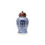 A CHINESE BLUE AND WHITE 'SHUANGXI' VASE 清十九世紀 青花囍紋罐