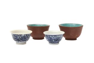 FOUR SMALL CHINESE CUPS 清十九世紀 宜興紫砂盃一對及青花盃兩件