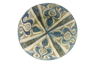 A LARGE COBALT BLUE AND BLACK-PAINTED KASHAN POTTERY BOWL Kashan, Iran, early 13th century