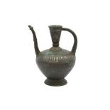 AN IMPRESSIVE FINELY ENGRAVED SILVER-INLAID BRONZE CEREMONIAL SPOUTED EWER Herat, Khorasan, Eastern