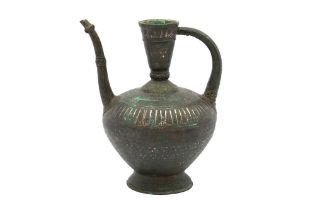 AN IMPRESSIVE FINELY ENGRAVED SILVER-INLAID BRONZE CEREMONIAL SPOUTED EWER Herat, Khorasan, Eastern