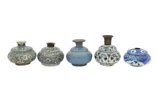 FIVE SMALL ASIAN-INSPIRED SAFAVID BLUE AND WHITE POTTERY VASES Iran, late 17th and 18th centuries