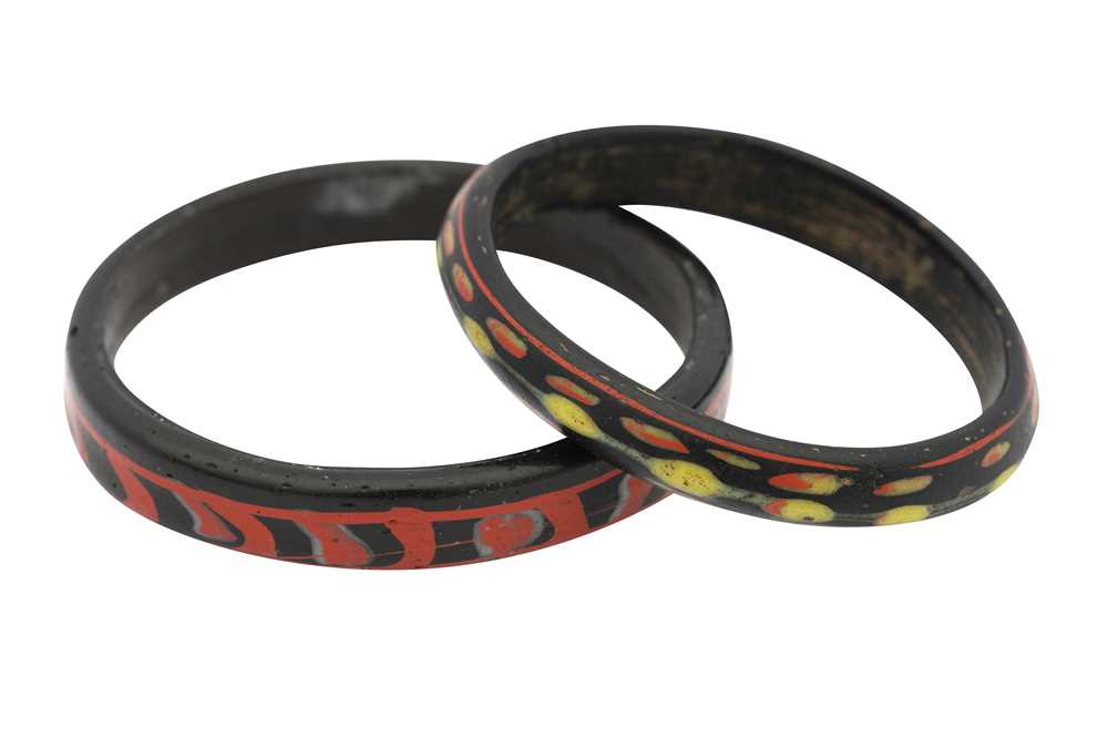 TWO POLYCHROME MARVERED HOT-WORKED GLASS BANGLES Possibly Egypt or Syria, 10th - 14th century