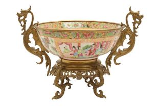 A CHINESE CANTON FAMILLE-ROSE BOWL IN A GILT-METAL MOUNT