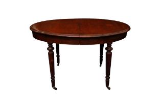 A REGENCY STYLE OVAL DINING TABLE