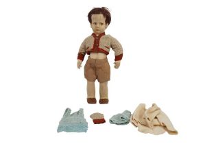 AN EARLY 20TH CENTURY LENCI BOY DOLL AND EXTRA CLOTHING