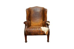 A 19TH CENTURY HUMPBACK WING ARMCHAIR