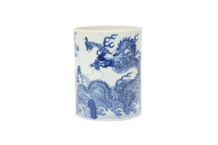 A CHINESE BLUE AND WHITE 'DRAGON AND CARP' BRUSH POT, BITONG 青花繪龍及鯉魚圖紋筆筒
