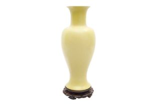 A CONTEMPORARY CHINESE-STYLE YELLOW GLAZED VASE ON STAND