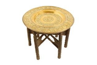 AN INDIAN OCCASIONAL TABLE WITH A LARGE COPPER TRAY WITH THE ZODIAC SIGNS Possibly Madras (Chennai),