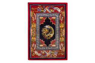 A FINE TIBETAN RUG WITH DRAGON DESIGN