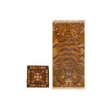 A FINE TIBETAN TIGER RUG AND TIBETAN MAT