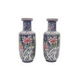 A PAIR OF SAMSON BLUE-GROUND FAMILLE-ROSE ROULEAU VASES
