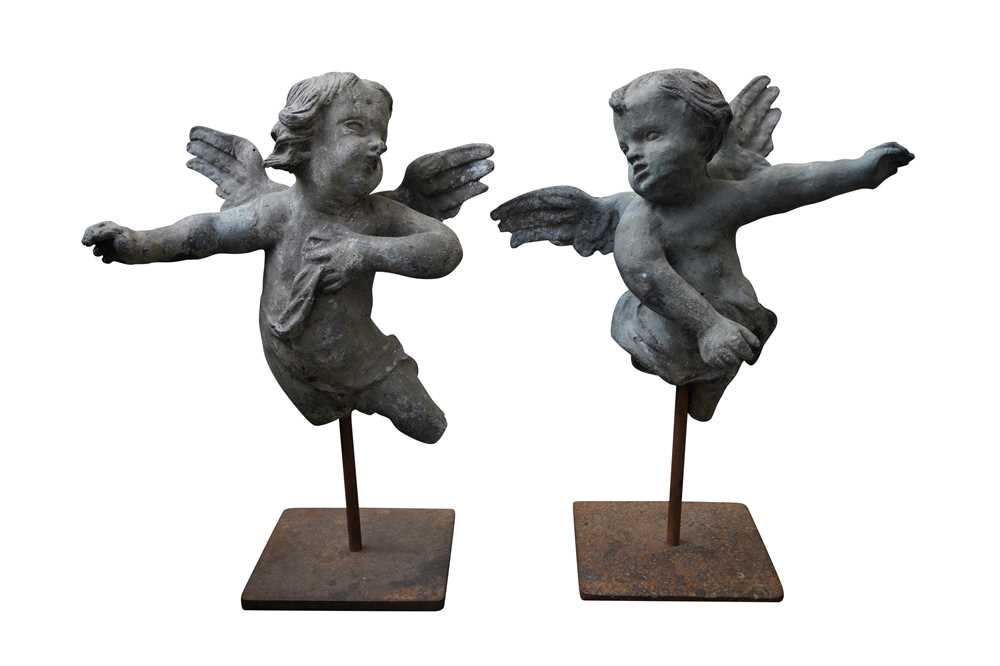 A PAIR OF LEAD FIGURES OF PUTTI