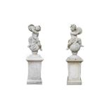 A PAIR OF COMPOSITION STONE MUSICAL PUTTI