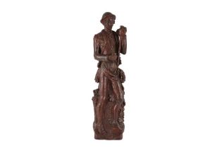 A TERRACOTTA WALL FIGURE OF A VIGNERON