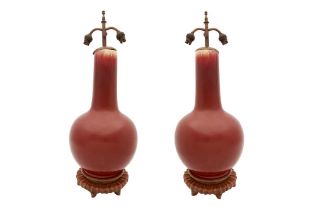 A PAIR OF LARGE CHINESE SANG DE BOEUF BOTTLE VASES