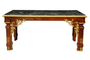 A CONTINENTAL MAHOGANY AND PARCEL GILT CONSOLE TABLE