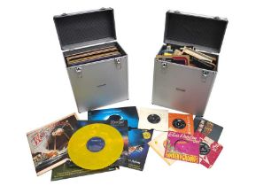A LARGE GROUP OF ASSORTED VINYL LPs & SINGLES IN TWO FLIGHT CASES