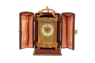 AN ANTIQUE CARRIAGE CLOCK